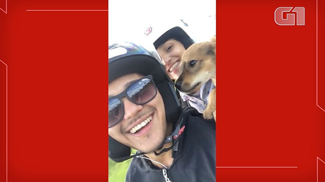 Casal de moto para com inten&ccedil;&atilde;o de vestir casaco e resgata c&atilde;o na BR-419